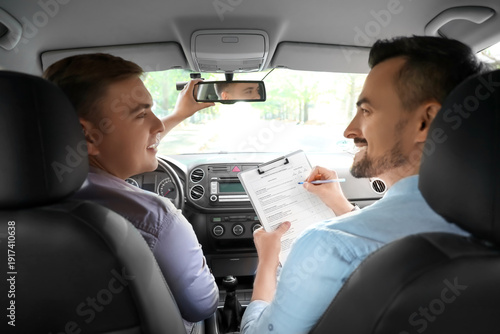 Young man with instructor a...