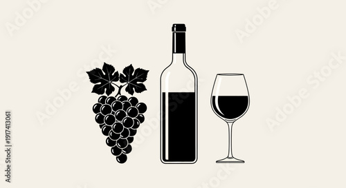 A bottle of wine and a glass beside a bunch of grapes on a table