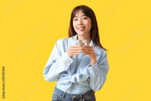 Young Asian woman with glas...