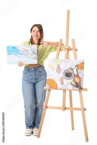 Young woman with paintings ...