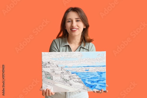 Young woman with painting b...