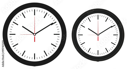 Two black-framed analog wall clocks display different times. 