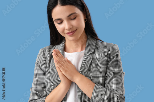 Thankful young woman on blu...