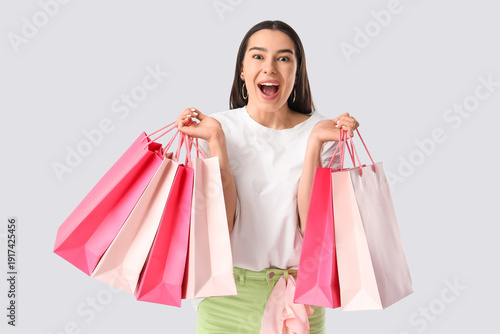 Happy young woman with shop...