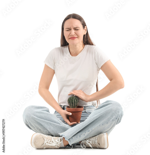 Young woman with cactus on ...