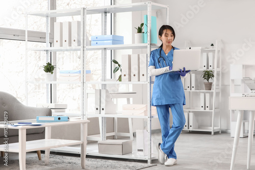 Female Asian doctor working...