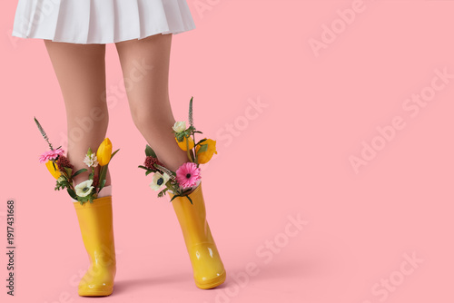 Legs of young woman in rubb...