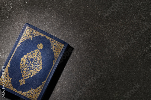 Koran on black grunge backg...