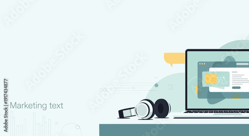 Modern laptop with marketing content on screen and headphones