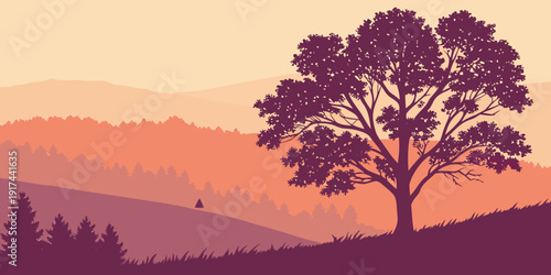 A majestic tree stands tall against a vibrant sunset over a mountainous landscape.
