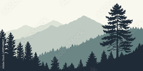 Majestic mountain range with dense forest of pine trees in the foreground