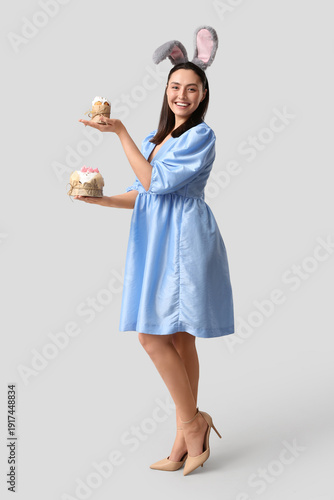 Happy young woman in bunny ...