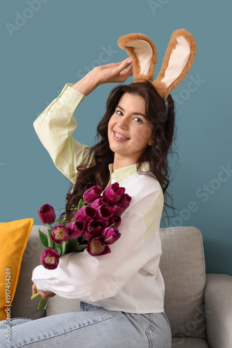 Young woman in bunny ears w...