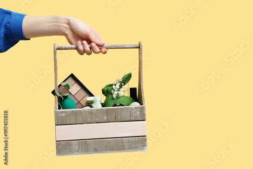 Female hand with wooden bas...