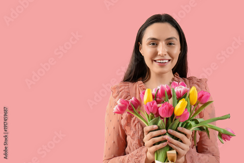 Happy young woman with bouq...