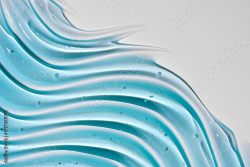 Liquid gel abstract cosmetic wavy background. Smear of transparent moisturizing product