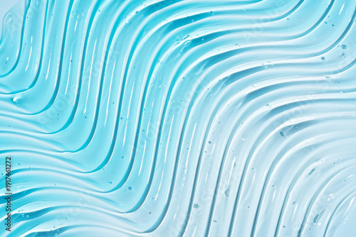 Close-up image displaying blue pure gel texture with glossy highlights and clear droplets, ideal for background use