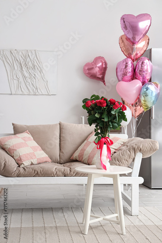 Interior of festive living room decorated with heart-shaped balloons for Valentine's Day celebration