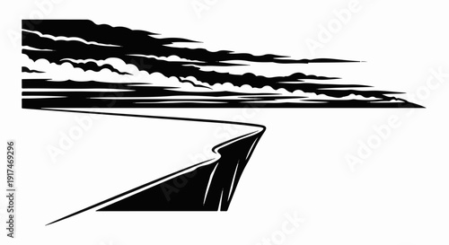 A stark black and white image of a winding road under a dramatic sky