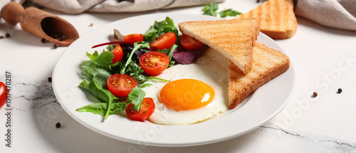 Plate with tasty fried egg,...