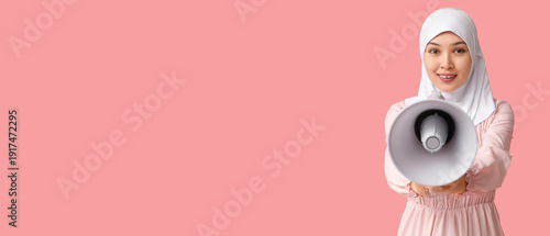 Young Asian Muslim woman wi...