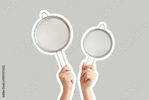 Female hands with sieves on...