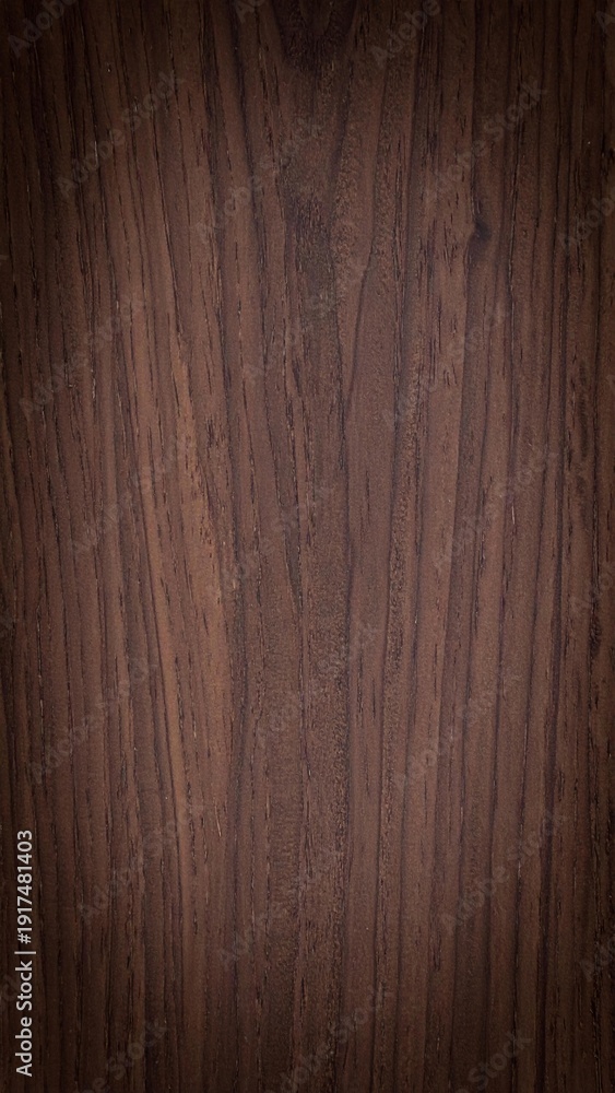 Naklejka premium Dark brown wood grain background with natural vertical stripes texture