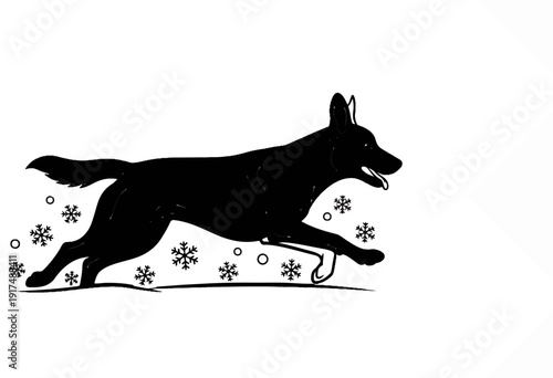 Black dog silhouette running through snow with snowflakes