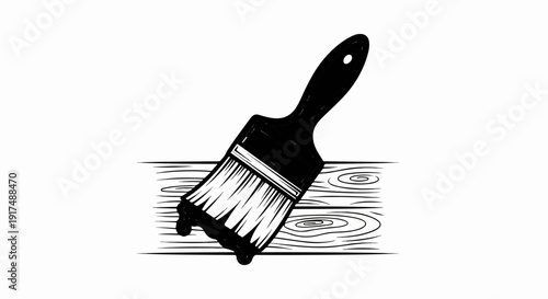 Black paintbrush applying black paint to wooden planks with texture