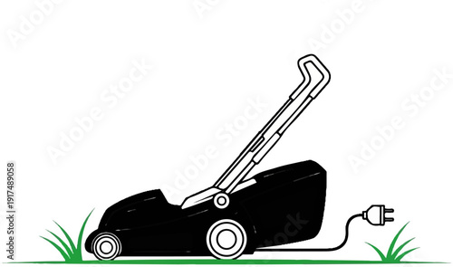 Black electric lawnmower with plug and cord on green grass