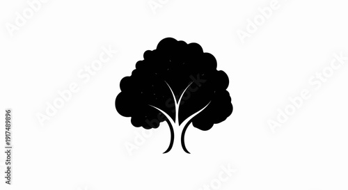 Black silhouette of a deciduous tree with a full canopy and bifurcated trunk
