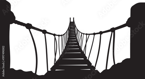 Silhouette of a suspension bridge over a deep chasm