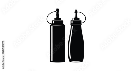 Two black condiment bottles stand side by side a striking silhouette