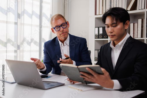 Φωτογραφία Team Of Business working at office with documents on his desk, doing planning an