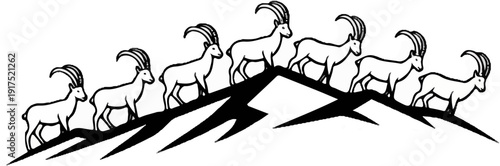 Herd of ibex silhouetted on mountain peaks