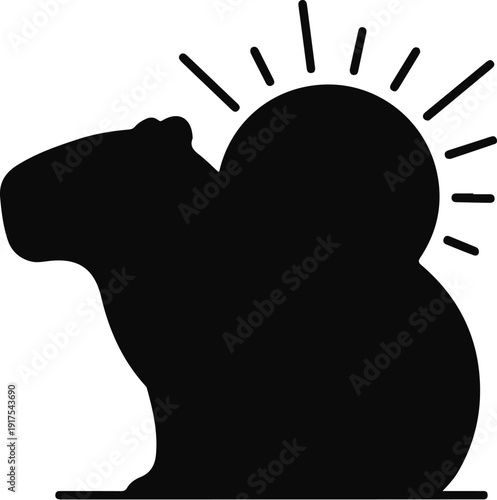 Silhouette of a capybara basking in the sun
