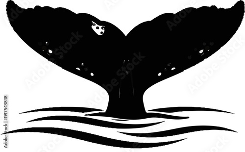 Silhouette of a whale's tail emerging from wavy water