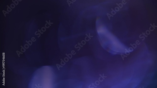 light leak and bokeh overlay with soft blue and purple hues creating a dreamy, ethereal effect. This can be used as a transition or a stylistic element in video editing.