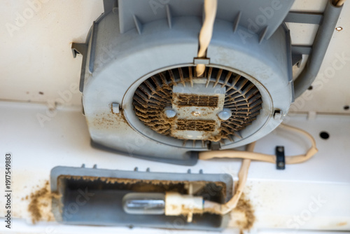 Photography Dirty kitchen extractor fan motor with heavy grease and dust buildup
