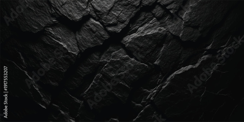Dramatic dark slate rock texture with sharp, fractured edges and deep shadows, natural stone background