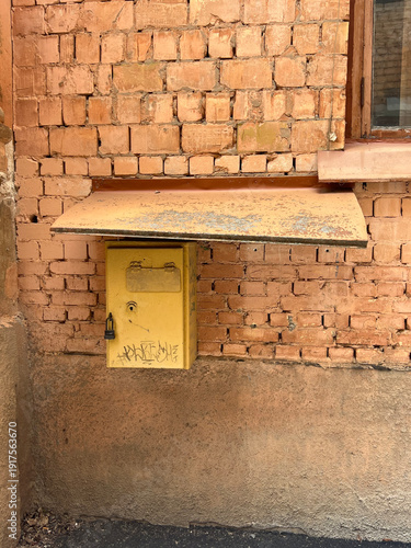 Weathered brick wall Kyiv Ukrainian, highlighting aged masonry, cracked plaster, and authentic urban texture