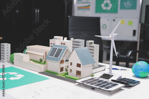 
 Two business people team planning and discussing of sustainable and renewable clean energy product with solar cell and wind turbine generator, CO2 emissions climate change global warming project