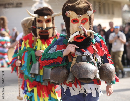Zemen, Bulgaria - March 15, 2025: Masquerade festival Surva in Zemen, Bulgaria. People with mask called Kukeri dance and perform to scare the evil spirits.
