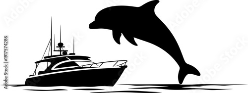 Bottlenose dolphin leaping out of water near luxury motor yacht silhouette