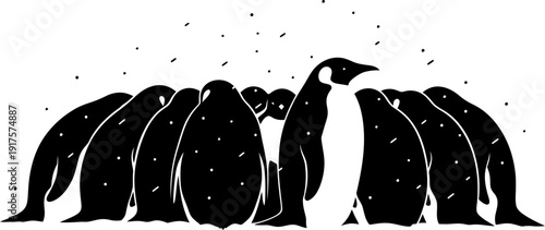 Emperor penguins huddling in snow silhouette