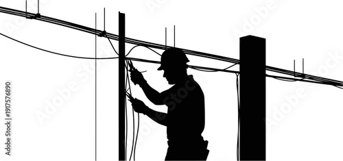 Silhouette of an electrician working on power lines