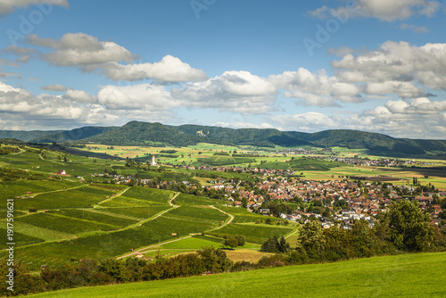 Panoramic view of the vineyards of the Klettgau wine region with the village of Hallau and Bergkirche St. Moritz in the distance, Canton of Schaffhausen, Switzerland