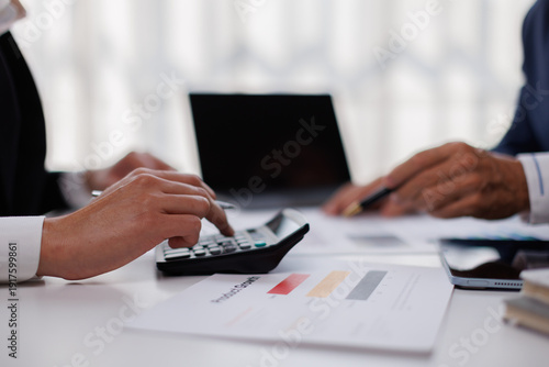 Fotografia Auditor and accountant team working in office, analyze financial data and accounting record with calculator