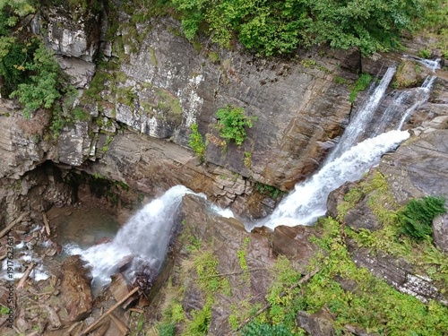 Wallpaper Mural Beautiful big waterfall in the mountains. Torontodigital.ca