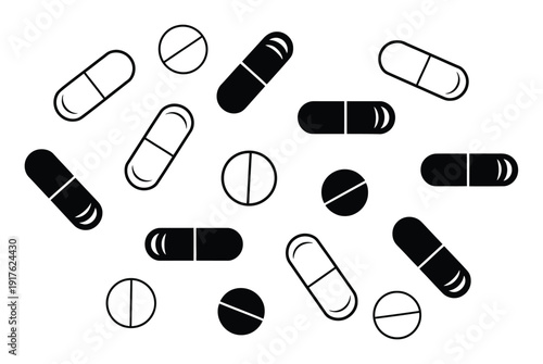 A Collection of Black and White Pill and Capsule Scattered on a White Background